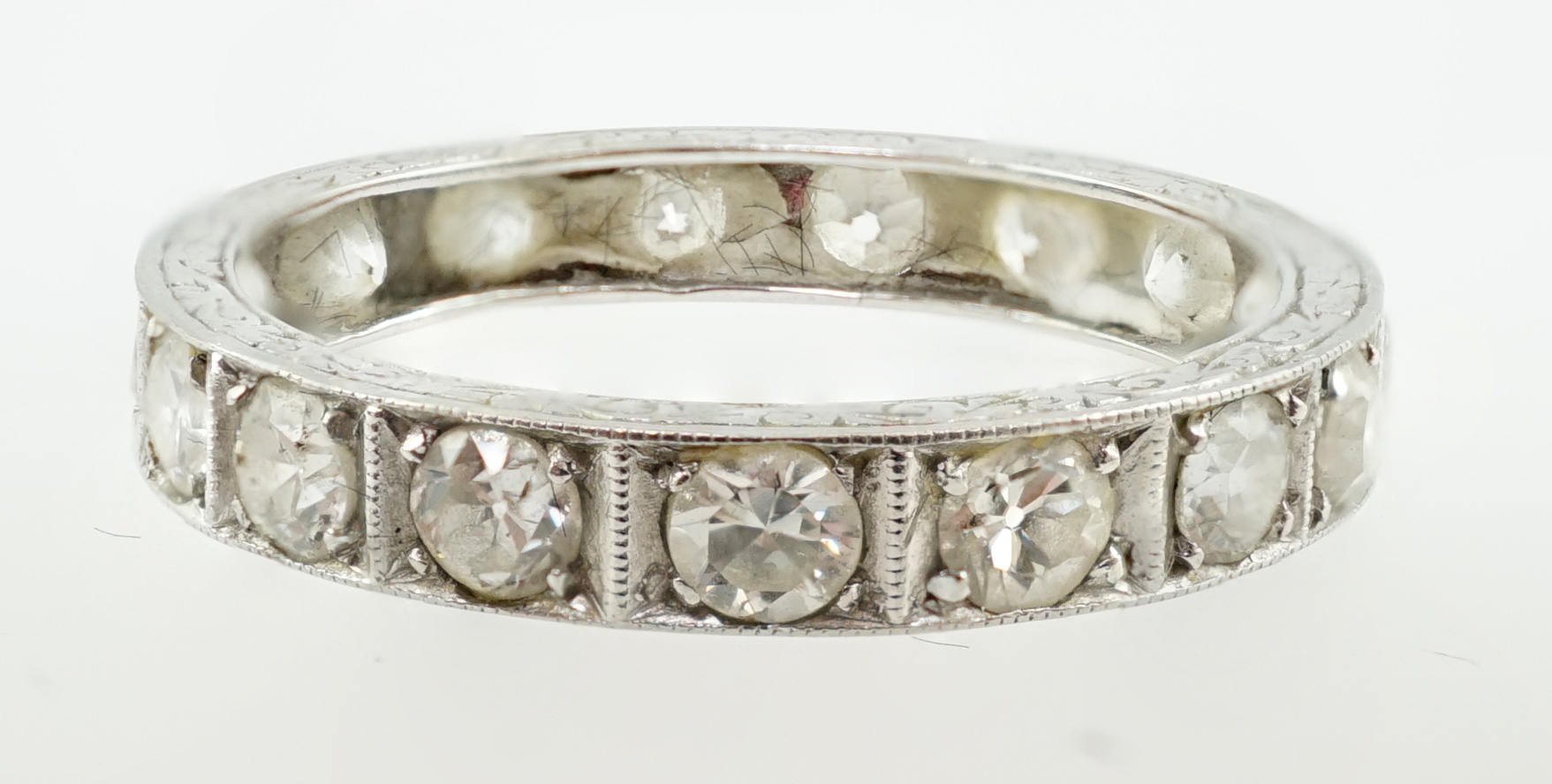 A mid 20th century platinum and diamond set full eternity ring